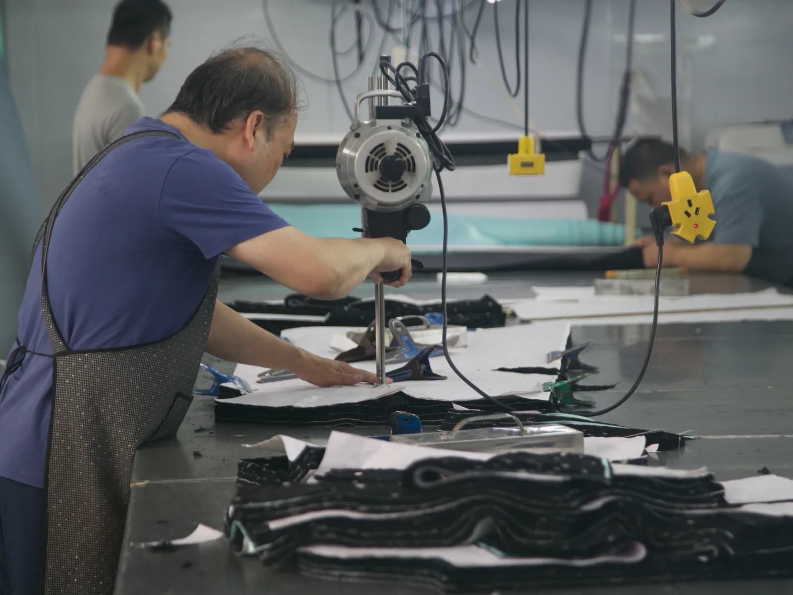 Garment panels being prepared on the PIPK cutting floor