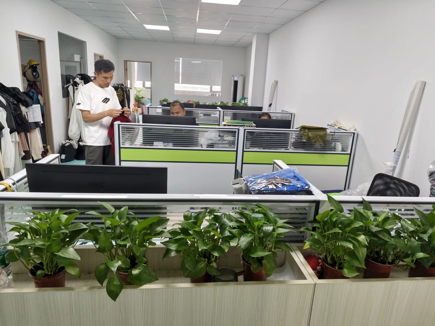 Production coordination workspace with a garment being reviewed at PIPK